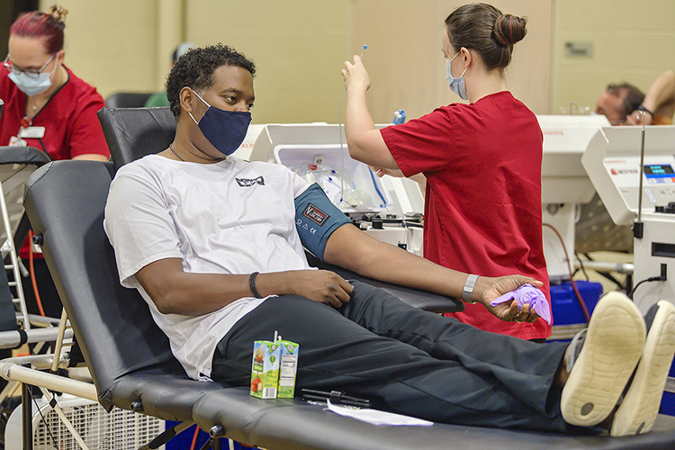 Rodney Francis of Murfreesboro, Tenn., prepares to donate blood with the help of an American Red Cross technician at MTSU’s 2020 “Bleed Blue to Beat the COVID-19 Blues” blood drive in this file photo. MTSU will mark Sept. 11 with its annual “Battle of the Branches” blood drive set for Thursday, Sept. 2, from 10 a.m. to 4 p.m. in Room 322 of the Keathley University Center. (MTSU file photo by Andy Heidt)