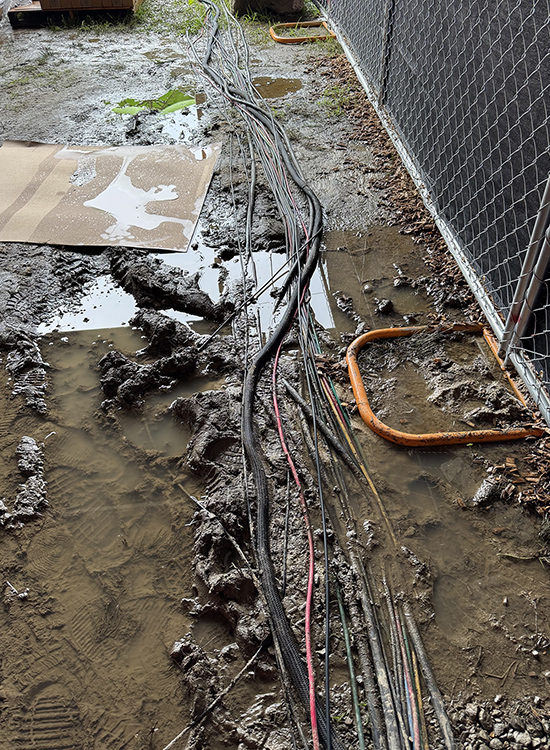 Increasingly muddy conditions like this plus inclement weather forecast for the weekend led organizers to cancel the Bonnaroo Music and Arts Festival on Friday night, June 13, cutting short Middle Tennessee State University’s annual visit to the four-day event in Manchester, Tenn., to provide students with hands-on experience with live event production, creating social media content and storytelling. (MTSU photo by Mike Forbes)