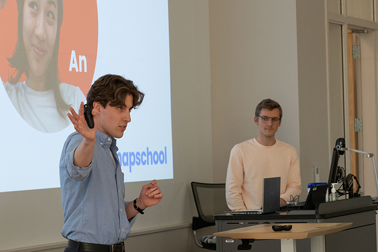 MTSU graduate student Conner McAnally, left, and graduating senior Pavel Sazonov present their business plan for MapSchool during the 2022 Business Plan Competition Finals held April 27 in the Academic Classroom Building. The event is presented by the Pam Wright Chair of Entrepreneurship within the Department of Management. MapSchool, a web mapping platform for educational institutions that allows students to explore campuses, won third place for best business plan. (MTSU photo by Darby Campbell-Firkus)