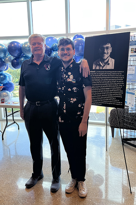 Jesse Penland, Middle Tennessee State University graduate counseling student and graduate assistant, right, takes a photo with his father, David Penland, during the “Humans of Murfreesboro” event put on by MTSU’s College of Education on Sept. 26, 2023, at the college’s building on campus. Penland was one of 11 local service professionals, such as teachers and police officers, featured at the event to help showcase these figures’ human stories with attendees. (Submitted photo)