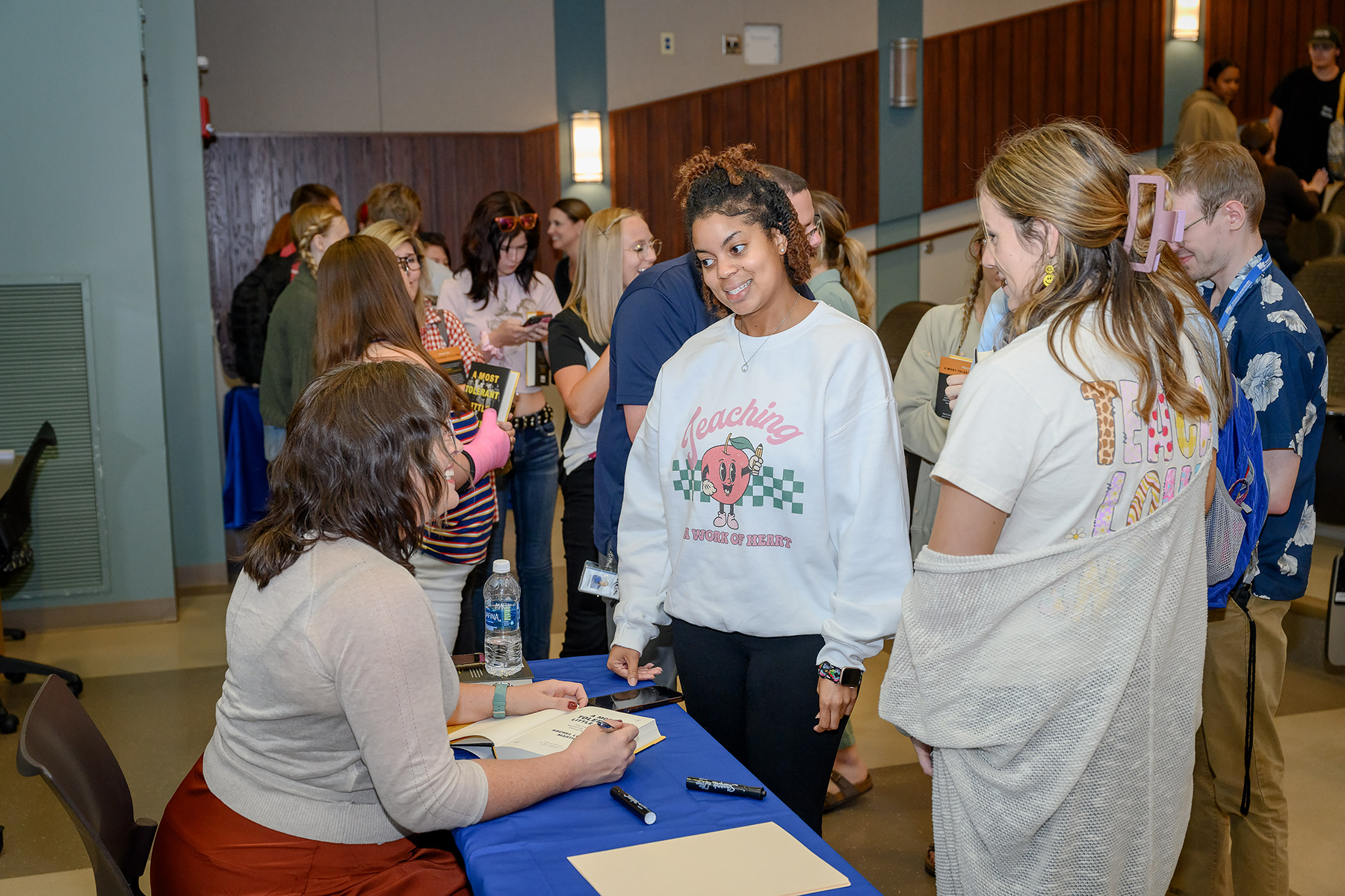 Rachel Martin, left, Middle Tennessee State University alumna and author, meets attendees at MTSU’s College of Education during the presentation for her latest release, “A Most Tolerant Little Town,” on Sept. 27, 2023, as part of the university’s larger MT Engage Week of events. (MTSU photo by James Cessna)