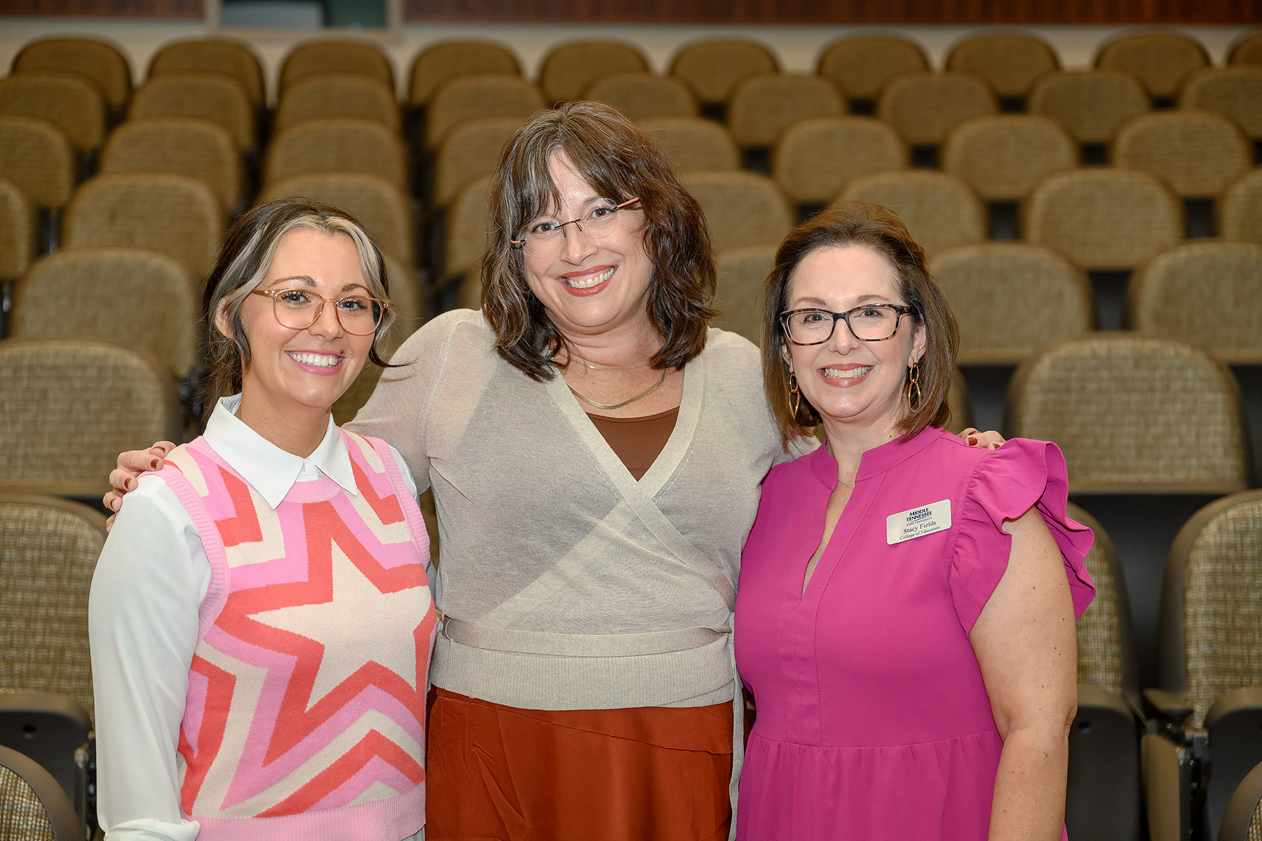 Stacy Fields, right, Middle Tennessee State University assistant education professor, takes a photo with Rachel Martin, center, MTSU alumna and author, and Bryanna Licciardi, MTSU lecturer in women’s and gender studies, at the event for Martin’s latest release, “A Most Tolerant Little Town,” on Sept. 27, 2023, at the College of Education building on campus. (MTSU photo by James Cessna)