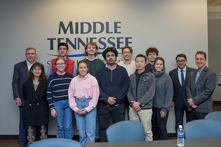 The inaugural cohort of students participating in MTSU’s Jennings and Rebecca Jones Chair of Excellence in Urban and Regional Planning Scholars Program pose for a photo with guest presenters Nov. 10, 2023, following a discussion on economic development at Middle Tennessee State University’s Business and Aerospace Building. At far left, back row, is faculty member and presenter Patrick Geho, state executive director of the Tennessee Small Business Development Center at MTSU. At far right is fellow presenter Patrick Cammack, senior vice president for economic development for the Rutherford County Chamber of Commerce. Second from right is Murat Arik, holder of the Jones Chair of Excellence in Urban and Regional Planning. (MTSU photo by Andy Heidt)