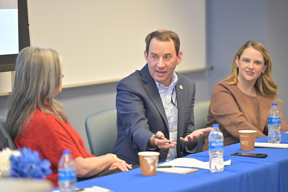 Kendrick Curtis, center, executive director of the Middle Tennessee Industrial Development Association, and Lori Odom, left, senior vice president of economic development with the Nashville Area Chamber of Commerce, discuss business and industrial recruitment as part of an economic development panel held Jan. 23 in the Business and Aerospace Building at Middle Tennessee State University in Murfreesboro, Tenn. At right is panelist Kalee Harryman, business development consultant with the Tennessee Department of Economic and Community Development. (MTSU photo by James Cessna)