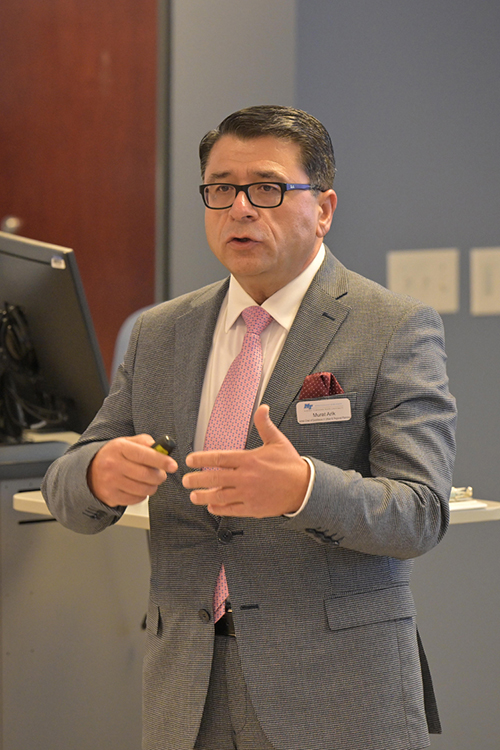 Middle Tennessee State University associate management professor Murat Arik, holder of the Jennings and Rebecca Jones Chair of Excellence in Regional and Urban Planning, welcomes attendees to the economic development panel co-hosted by the chair and the Rutherford County Chamber of Commerce held Jan. 23 in the Business and Aerospace Building on campus in Murfreesboro, Tenn. (MTSU photo by James Cessna)