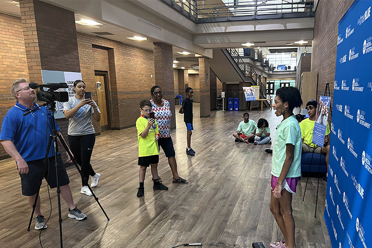 Dan Eschenfelder, left, a professor in the School of Journalism and Strategic Media at Middle Tennessee State University, films students from the Boys and Girls Clubs of Rutherford County inside the Bragg Media and Entertainment Building to show what it is like to be on camera during the recent “Come to Voice” digital media summer camp sponsored by the College of Media and Entertainment. Jennifer Woodard, center, a camp facilitator, professor and assistant media college dean, watches as students are filmed during the camp, which brought 20 seventh through ninth graders to MTSU to learn about digital media and other career paths offered at Murfreesboro, Tenn., university. (MTSU submitted photo)