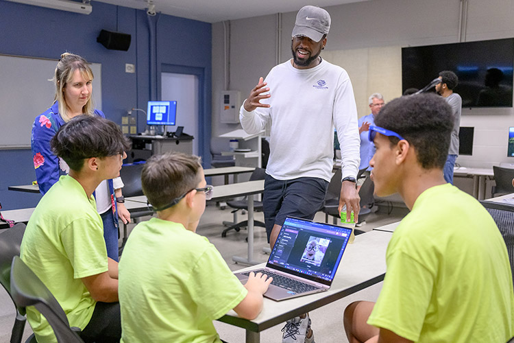 Andrea Hall, a professor in the School of Journalism and Strategic Media at Middle Tennessee State University in Murfreesboro, Tenn., introduces campers to the field of public relations during the recent digital media camp. Students from the Boys and Girls Clubs of Rutherford County attended the 2024 “Come to Voice” summer digital media camp at MTSU. (MTSU photo by J. Intintoli)