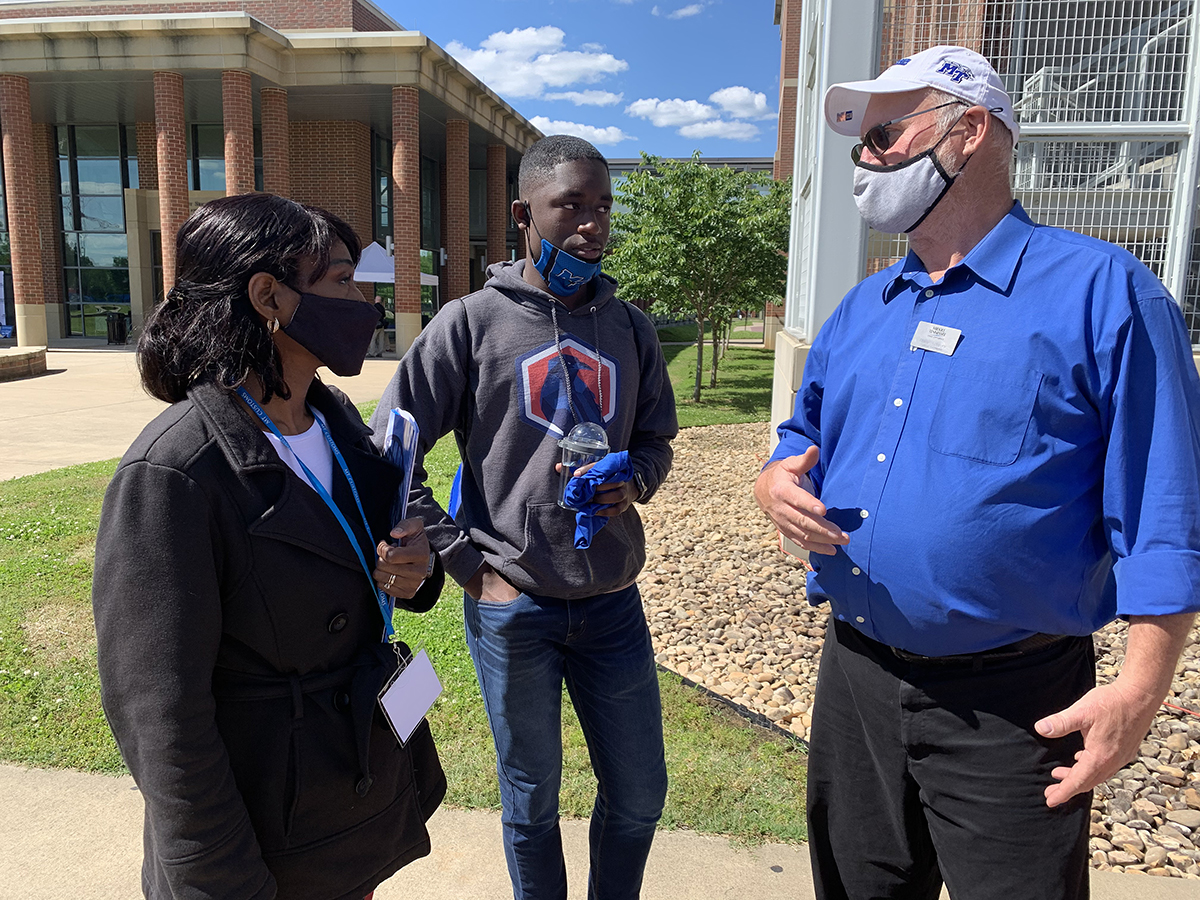 Nicole Cormier, left, and her son, Jordan Cormier, 16, both from Franklin, Tenn., listen as MTSU Campus Recreation Center Director Charlie Gregory shares all the rec center has to offer recently during a freshman CUSTOMS orientation near the parking garage adjacent to the Student Services and Admissions Center. CUSTOMS continutes until early August. (MTSU photo by Randy Weiler)