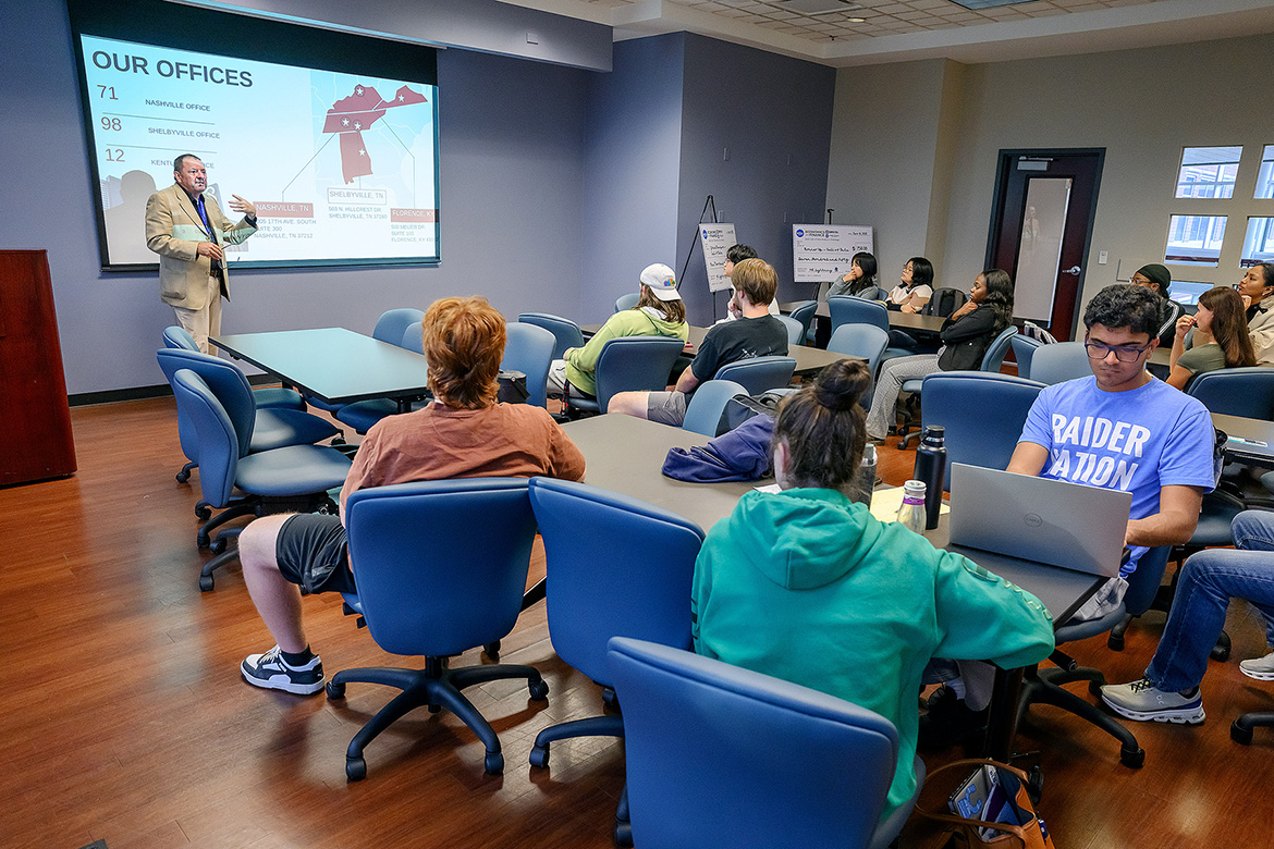 Stuart Fowler, chair of the Department of Economics and Finance at Middle Tennessee State University in Murfreesboro, Tenn., gives instructions to students participating in “The Call of Data” 24-hour analytics challenge held Nov. 7-8 inside the Business and Aerospace Building. (MTSU photo by Andy Heidt)