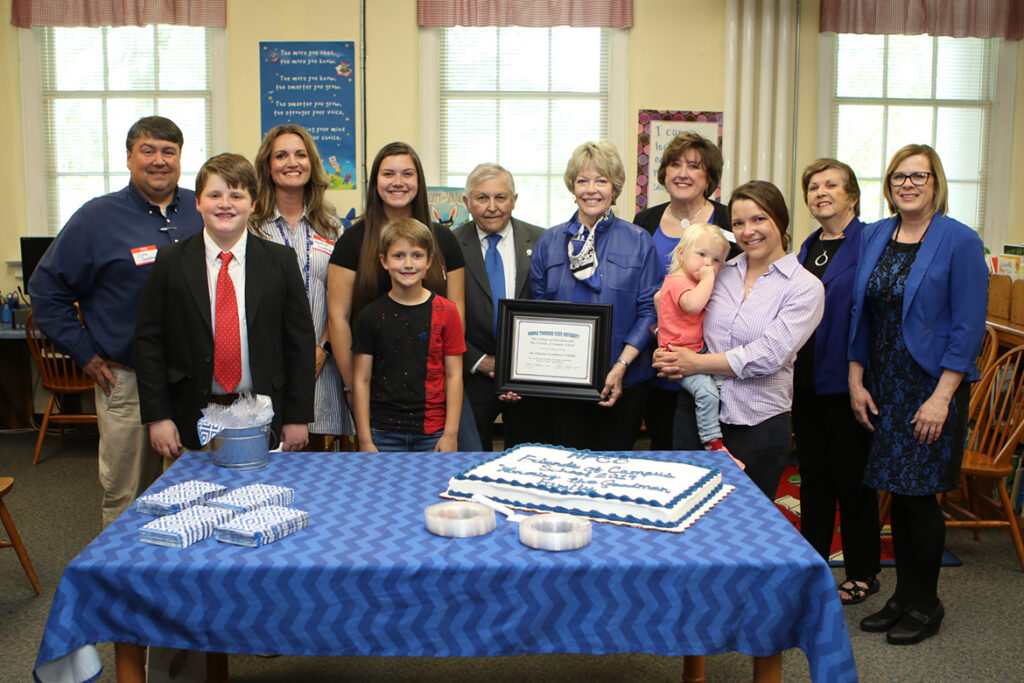 The Friends of Campus School honored the Charles Goodman family for its longstanding connections to the school during the Tuesday, April 16, open house and 90th anniversary celebration at the Lytle Street campus. Pictured, from left, are John Goodman, Jack Goodman, Heather Goodman, Annabelle Goodman, Knox Goodman, Charles Goodman, Delia Goodman, MTSU Education Dean Lana Seivers, Carolyn Goodman-Henn, Marcie (being held), Friends of Campus School President Rita Schaerer-King and school Principal Sherry King. (MTSU photo by James Cessna)