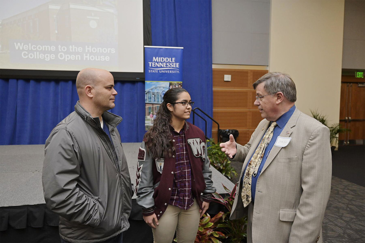 David Willequer, left, and his daughter, Ana Cannon, both of Clarksville, Tenn., listen as MTSU Dean John Vile shares about life in the University Honors College, which held an open house Feb. 18 for prospective students in the Student Union Ballroom and other campus venues. (MTSU photo by Andy Heidt)