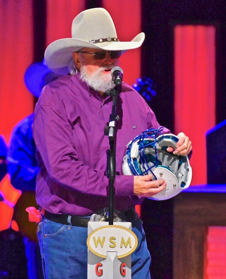 Country Music Hall of Famer Charlie Daniels, namesake and patron of MTSU’s Charlie and Hazel Daniels Veterans and Military Family Center, speaks to the Grand Ole Opry audience after receiving a surprise gift from MTSU during his Oct. 15 show in Nashville, Tenn. (MTSU photo by Cat Curtis Murphy)