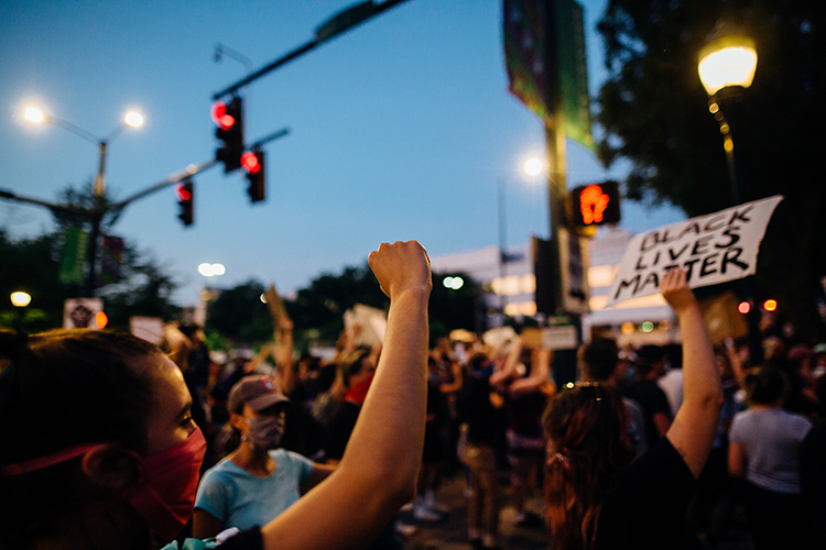 People raise their fists, voices and signs in support of the Black Lives Matter movement during a June 2 protest in downtown Chattanooga, Tenn., that drew hundreds of participants to call for racial equality and justice and to pay tribute to George Floyd, who died May 25 after a Minneapolis police officer kneeled on his neck during an arrest. (Photo courtesy of Kelly M. Lacy/Pexels)