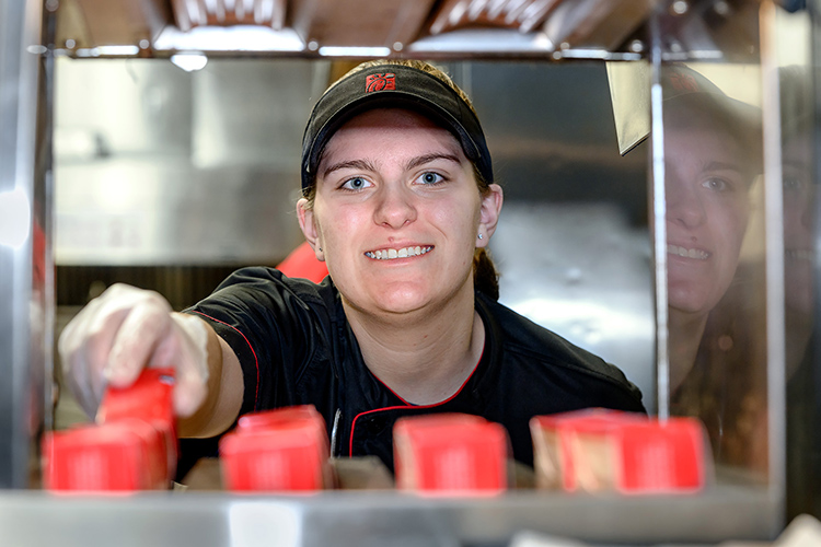 Kaylin Garton, shift lead at Chick-fil-A Murfreesboro, and her co-workers are now eligible for tuition assistance to take courses at Middle Tennessee State University under an agreement signed Wednesday, Jan. 12, between the university and the fast-food chain. (MTSU photo by J. Intintoli)