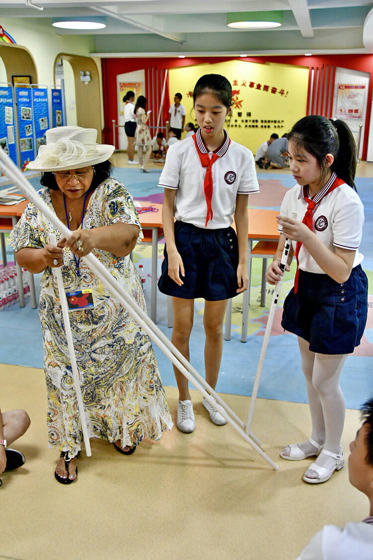 MTSU first lady Elizabeth McPhee, a retired Murfreesboro City Schools teacher, conducts a classroom demonstration Monday, July 16, for Chinese students at Dongcheng Educational Group in Hangzhou, China. (MTSU photo by Andrew Oppmann)
