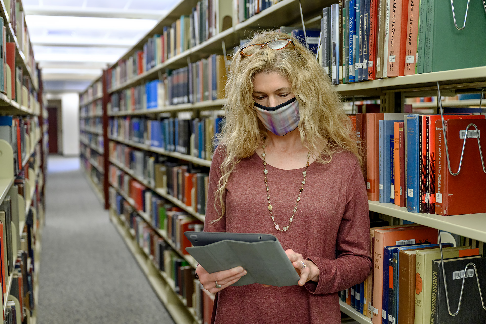 Profile portraits for Christy Groves, Interim Associate Dean for the Walker Library. (Photo: J. Intintoli)
