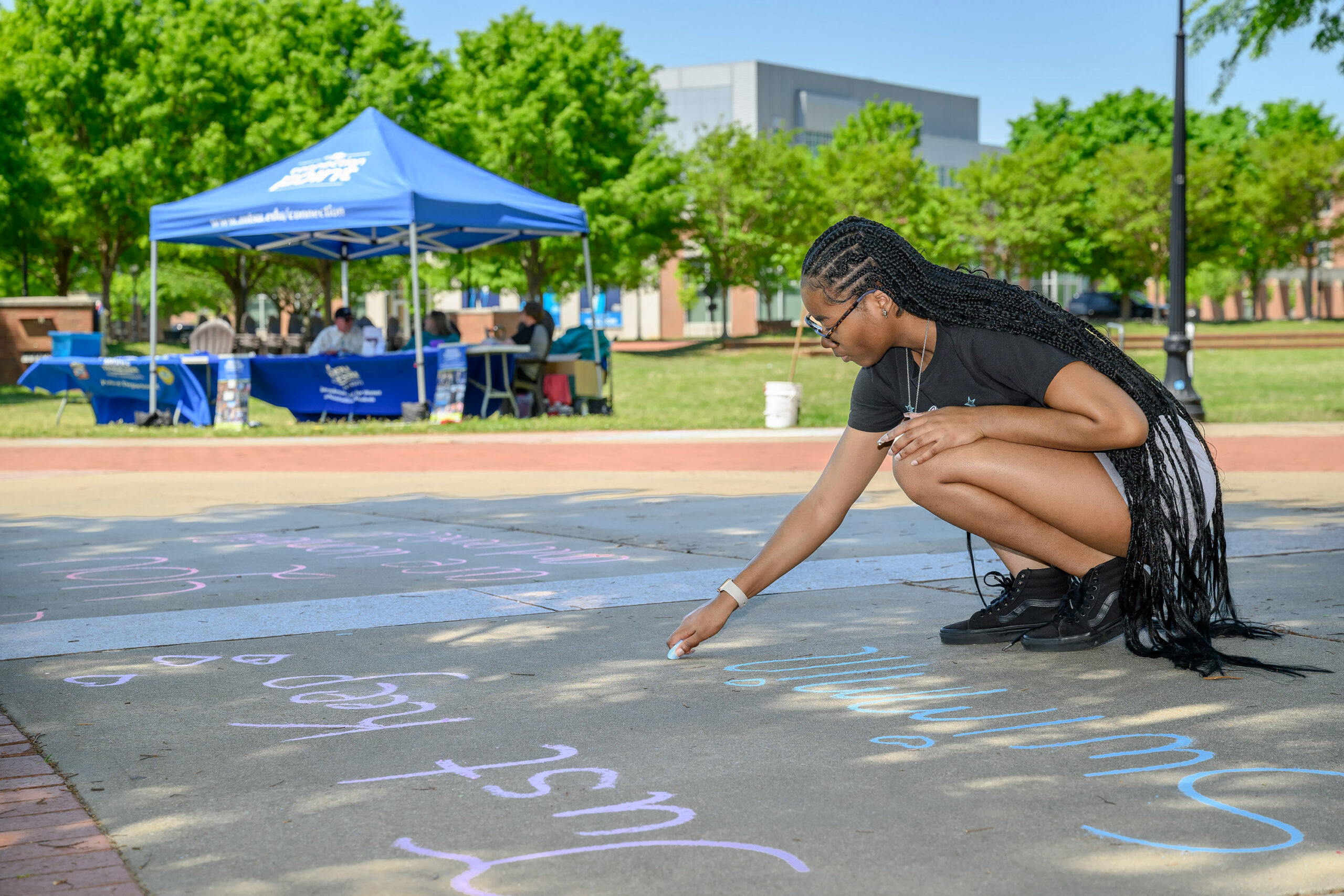 A student at Middle Tennessee State University in Murfreesboro, Tenn., uses chalk to decorate the sidewalk in front of the Student Union Building, 1768 MTSU Blvd., as part of the annual Color the Commons event that is part of the Sexual Assault Awareness Month activities spearheaded by the June Anderson Center for Women and Nontraditional Students. This year’s event will be happening in the same location from 10 a.m. to 2 p.m. Thursday, April 24. (Submitted photo)