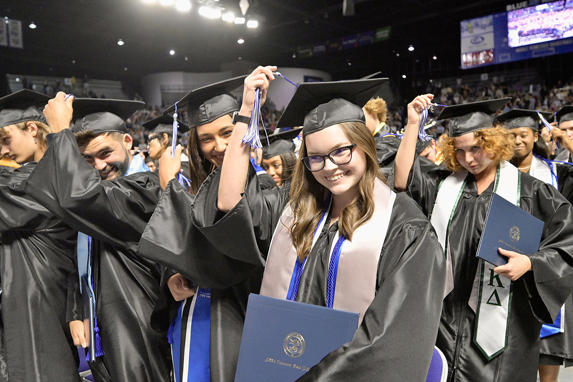 A group of proud spring 2023 Middle Tennessee State University graduates relocate their tassels to signal their accomplishment during the May 5 ceremony in Hale Arena inside Murphy Center. The summer 2023 commencement is set for 9 a.m. Saturday, Aug. 12, at Murphy Center. (MTSU file photo by Andy Heidt)