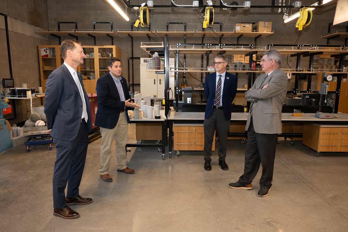 From left, Tennessee Department of Economic Development Commissioner Stuart McWhorter, Middle Tennessee State University Concrete Industry Management Director Jon Huddleston, College of Basic and Applied Sciences Dean Greg Van Patten and Joe Bales, vice president of University Advancement, discuss the advantages students have in one of the top concrete programs in the nation. (MTSU photo by James Cessna)