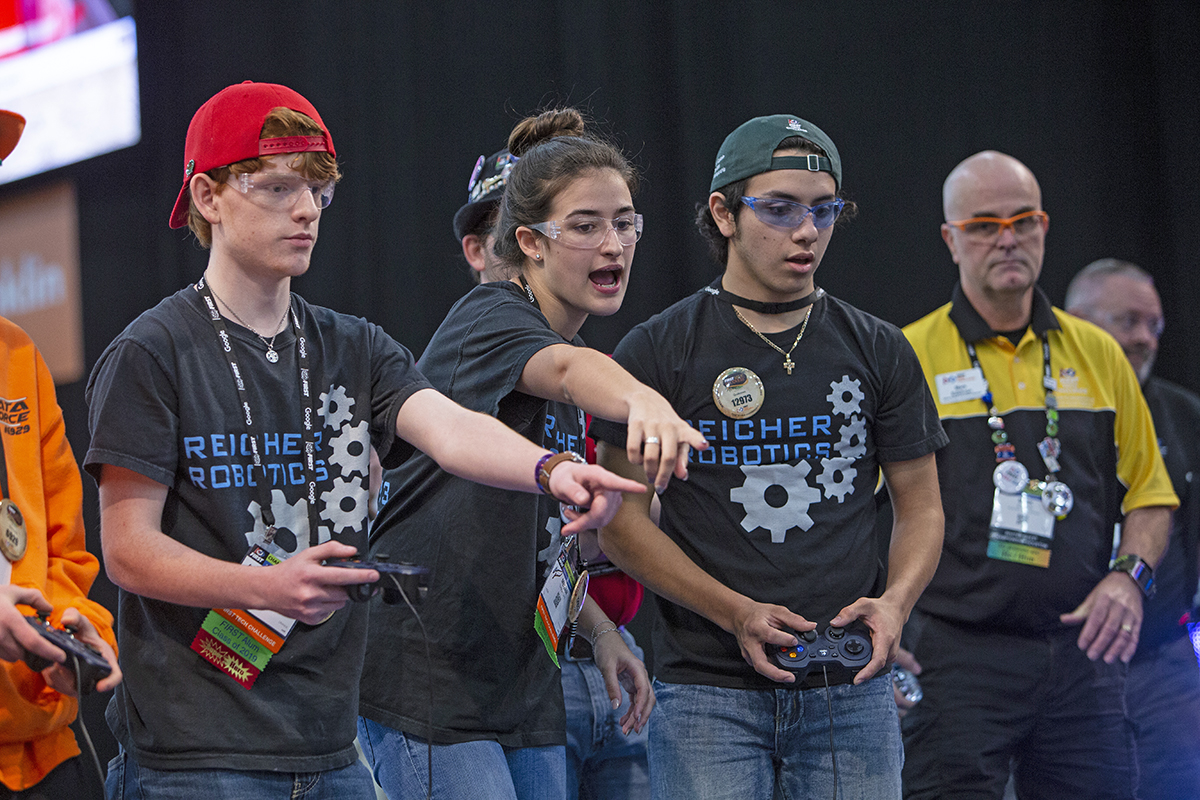A team competes during a match at a FIRST Robotics competition. 