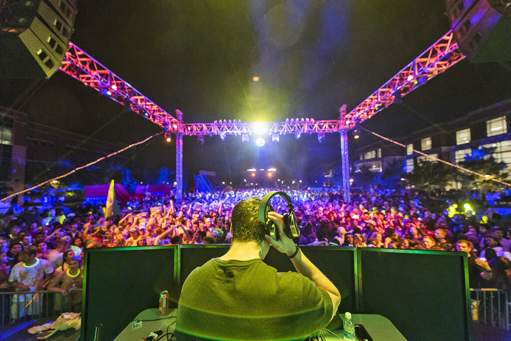 In this fall 2017 file photo, a DJ entertains the crowd of MTSU students attending the Crash the Commons event held on the Student Union Commons. The event includes live music, free food and host of other activities to welcome new students to campus. (MTSU file photo by Eric Sutton)