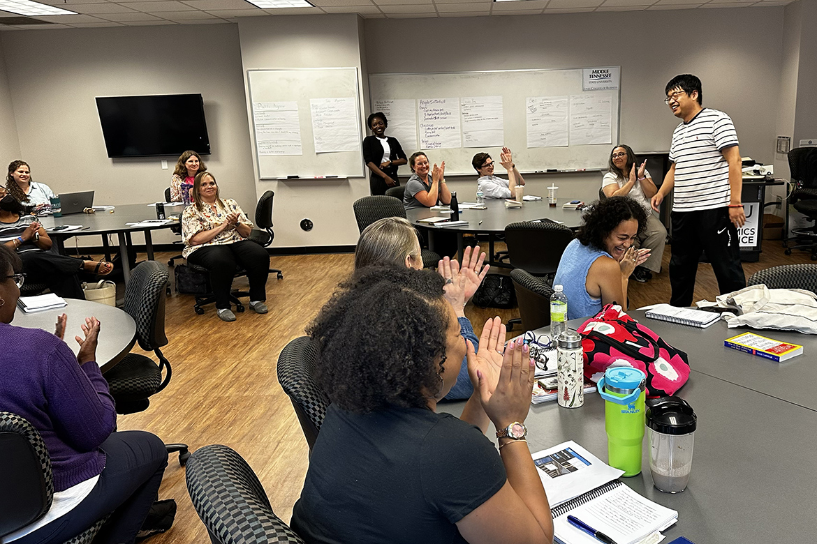 Shiang Liu, an associate professor in the Department of Economics and Finance, receives a hand following his presentation on bitcoin during the three-day Dale Carnegie summer immersion course held in early August for Middle Tennessee State University faculty and staff inside the Business and Aerospace Building on campus in Murfreesboro, Tenn. (MTSU photo by Darby Campbell-Firkus)