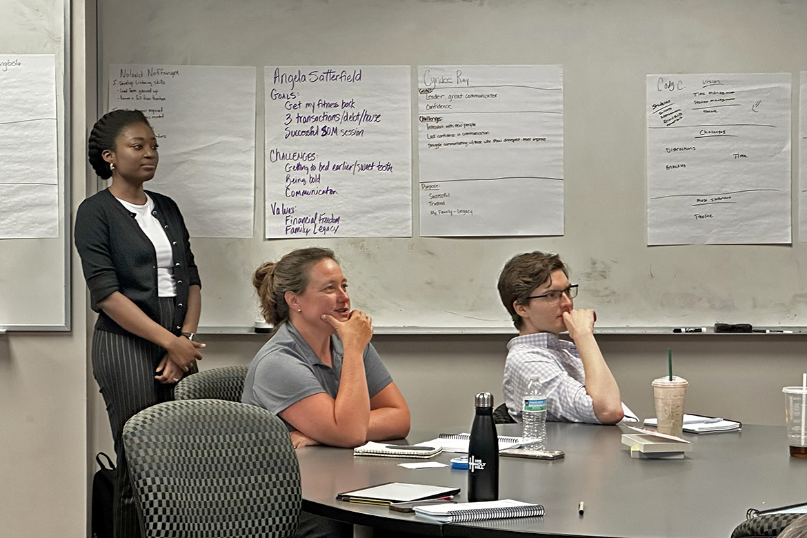 From left, Tobi Ayangbola, a lecturer in the Chemistry Department Angela Satterfield, admissions coordinator in the School of Music, and Cody Cunov, an assistant professor in the Department of Information Systems and Analytics, listen to a presentation during the three-day Dale Carnegie summer immersion course for Middle Tennessee State University faculty and staff held in early August inside Business and Aerospace Building on campus in Murfreesboro, Tenn. (MTSU photo by Darby Campbell-Firkus)