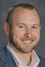 Dr. Daniel Smith, director of the Political Economy Research Institute; associate professor in Economics and Finance