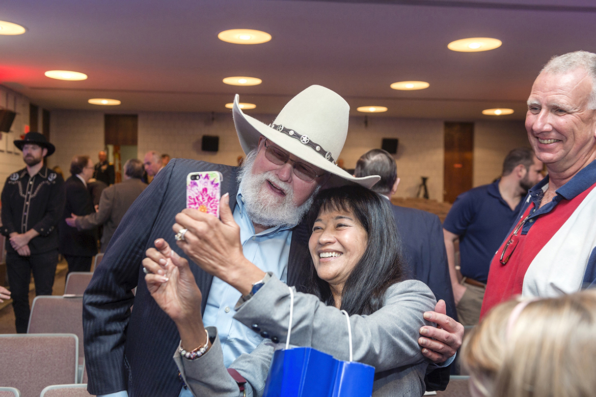 Country music legend Charlie Daniels shares a selfie with Many Bears Grinder, then-Tennessee Department of Veterans Affairs commissioner, at the official opening ceremony of the MTSU Veterans and Military Family Center inside Keathley University Center. The center would be renamed in honor of Daniels and his wife, Hazel, the following year. Daniels died Monday, July 6, at Summit Medical Center in Hermitage, Tenn. (MTSU file photo by J. Intinoli)