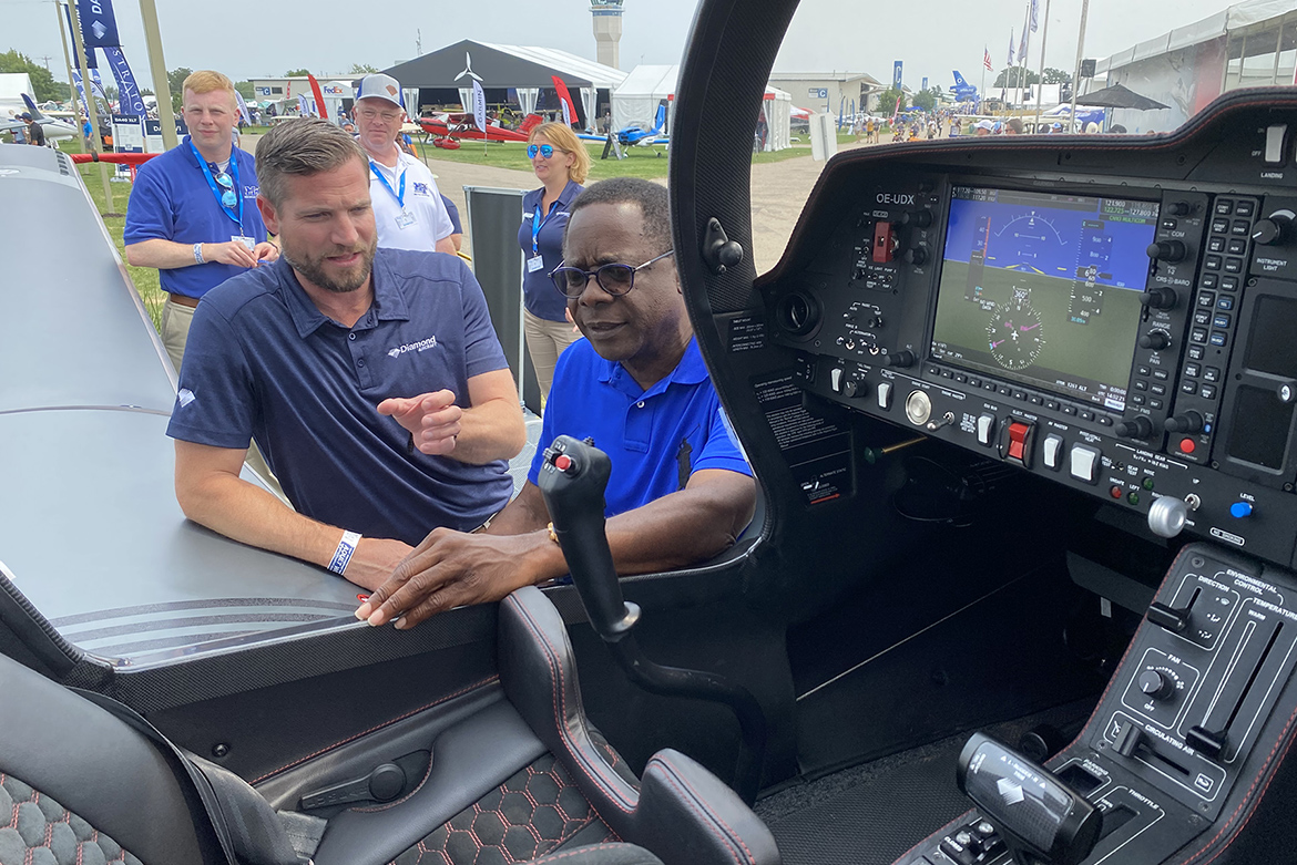 Diamond Aircraft CEO Scott McFadzean, left, shows MTSU President Sidney A. McPhee an advanced DA-50 aircraft in front of company’s booth on the grounds of the EAA AirVenture 2021, which runs July 26-Aug. 1 in Oshkosh, Wisc. Diamond Aircraft is the fleet supplier for the university, which also set up booth promoting its Aerospace Department. (MTSU photo by Andrew Oppmann)