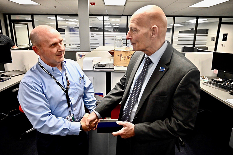 Kurt Robinson, Delta’s manager for quality control and receiving inspection and president of the airline’s veterans group, presented retired Army Lt. Gen. Keith Huber, MTSU’s senior advisor for veterans and leadership initiatives, with a replica of Delta’s pilot wings, embossed with the five service seals of the armed forces, to honor Huber’s commitment to veterans. (MTSU photo by Andrew Oppmann)
