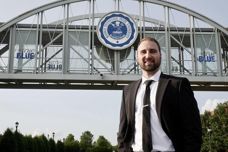 Middle Tennessee State University senior integrated studies major Devin Hill of Smyrna, Tenn., shown here in front of the bridge over Blue Raider Drive on campus, will graduate this summer after returning to MTSU after 10 years to earn his degree thanks to the Adult Degree Completion Program. (Submitted photo)