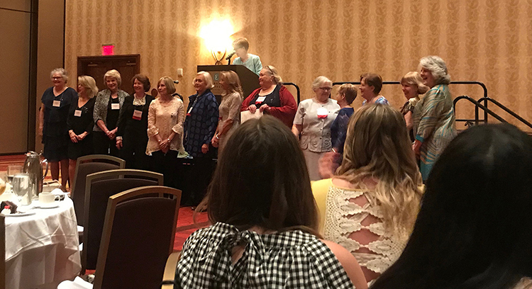Some alumnae of the Diamond Circle (50-year members) of the MTSU Epsilon Tau chapter of Alpha Delta Pi pose for a group photo for the 50th anniversary of its founding through a series of events April 12-13 on and off campus. Pictured, from left, are Janet Walls Covington, Linda Pruett Tarkington, Susan Pearsall Morris, “Ishy” Rea Neelly, Terry Denniston, Barbara Moore Reynolds, Diane Gannon Shubert, Carolyn Clay Hudspeth, Judy Rayburn Andrews, Jan Mayberry Moore, Jan Wright Sine, Janet Cope, and Pam Zimmerman. On the podium presiding over the ceremony is Jennifer McGhee Siler, also an MTSU alumna and current Alpha Delta Pi International secretary. (Submitted photo)