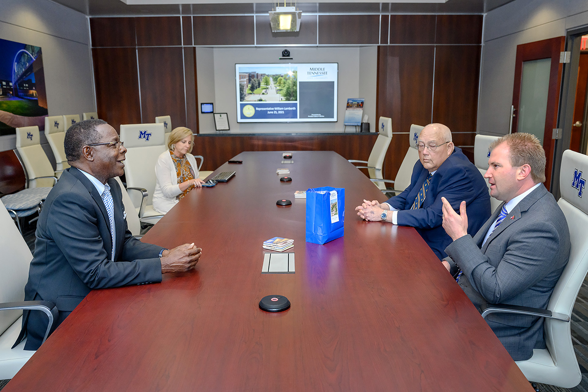 State Rep. William Lamberth, right, the majority leader in the Tennessee House of Representatives and MTSU President Sidney A. McPhee discuss the university’s growth during a meeting in the President’s Conference Room in the Cope Administration Building Friday, June 25. As Executive Assistant Kim Edgar, second from left, and attorney and state lobbyist Russ Farrar listen, McPhee responds to Lamberth’s question on how MTSU graduates can become part of the workforce with Oracle and Amazon. (MTSU photo by J. Intintoli)