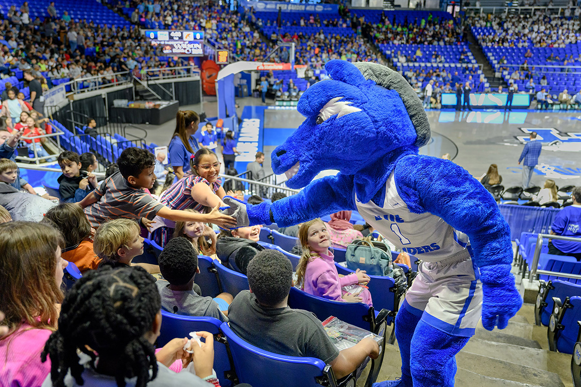 Middle Tennessee State University mascot Lightning shakes hands with excited students from Murfreesboro City Schools attending the 10th annual Education Day game Nov. 9, 2023, at Murphy Center where the Lady Raiders women’s basketball team defeated the Florida A&M Rattlers by a score of 93-48. (MTSU photo by J. Intintoli)