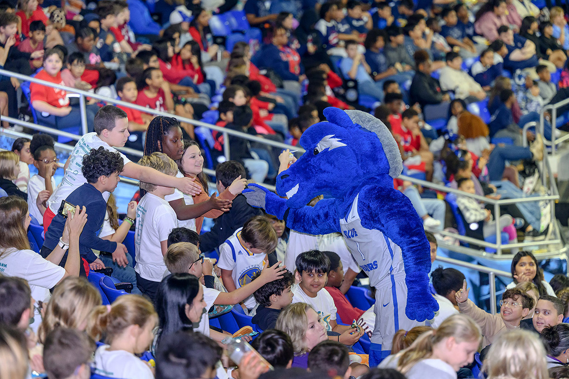 Middle Tennessee State University mascot Lightning shakes hands with excited students from Murfreesboro City Schools attending the 10th annual Education Day game Nov. 9, 2023, at Murphy Center where the Lady Raiders women’s basketball team defeated the Florida A&M Rattlers by a score of 93-48. (MTSU photo by J. Intintoli)