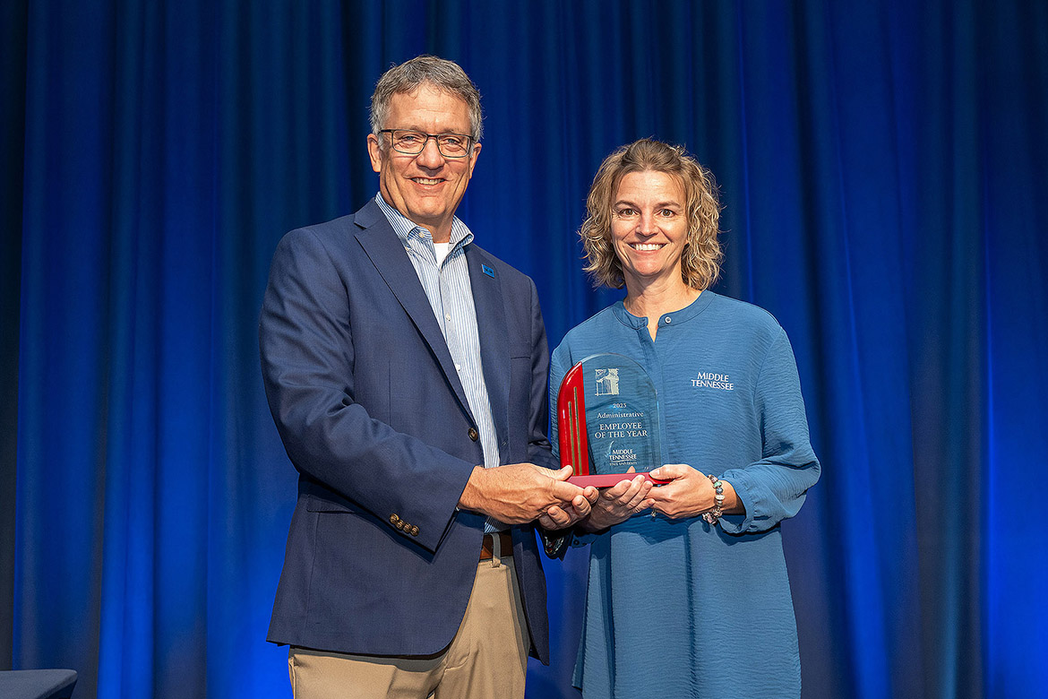 Middle Tennessee State University Provost Mark Byrnes presents the 2024-25 Administrative Employee of the Year Award to Quintina Burton from Event Coordination at a ceremony held Thursday, April 24, at James Union Building on campus in Murfreesboro, Tenn. She was one of four employees to receive an award. (MTSU photo by Andy Heidt)