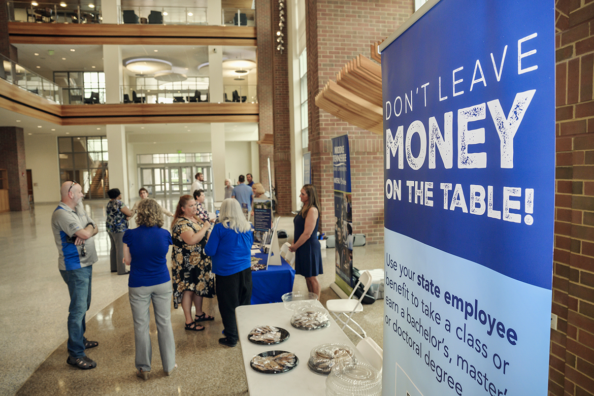 MTSU staff and administrators from various departments talk with university employees about opportunities to take up to four classes in a calendar year during a recent session in the Student Union first-floor atrium. MTSU Online, University College, the College of Graduate Studies, the College of Education and Master of Arts in Liberal Arts had representatives available to answer questions about a variety of topics. (MTSU photo by Andy Heidt)