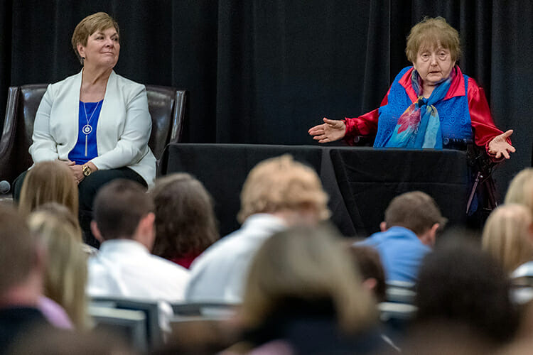 Holocaust survivor Eva Moses Kor, right, makes a point during her Oct. 30 address at MTSU’s Holocaust Education Day commemoration in the Student Union Building. At left is Jill Coble, Tennessee Holocaust Commission teacher fellow and panel moderator. MTSU’s Jewish and Holocaust Studies Program, the Tennessee Holocaust Commission and the MTSU Department of English sponsored the Holocaust Conference keynote featuring Kor, co-author of “Surviving the Angel of Death” with Lisa Rojany Buccieri. Kor and her identical twin, Miriam, were held captive in the notorious Auschwitz death camp and survived sadistic genetic experimentation by the Nazis. (MTSU photo by J. Intintoli)