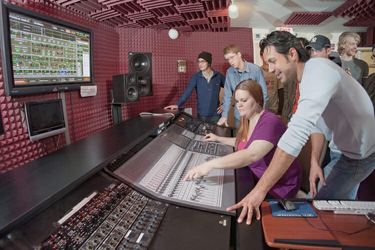 Department of Recording Industry professor Matt Foglia works with students in his audio production class inside Ezell Studio D, one of the fully equipped music recording and production studios for students in MTSU’s College of Media and Entertainment. (MTSU file photo by Andy Heidt)