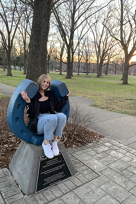 Gabriela Fisher, senior business management student at Middle Tennessee State University, gets to pursue her studies with four of her 10 siblings, the group of five meeting up for study dates and getting to support each other through their True Blue experience. (Submitted photo)