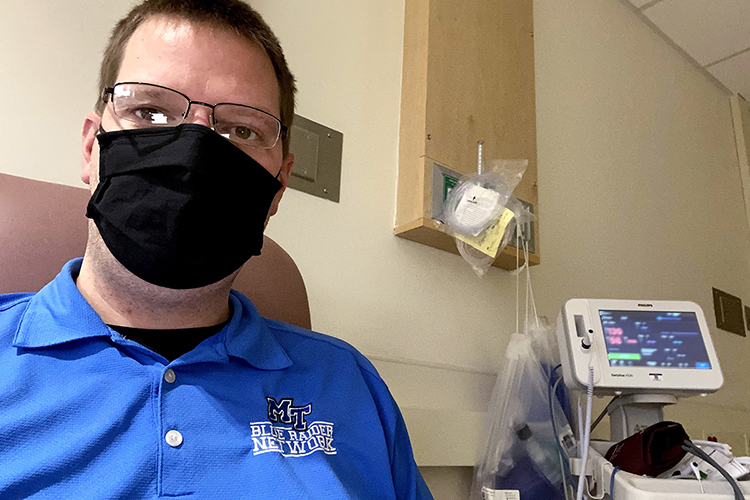 Mike Forbes, assistant director for technical systems in Middle Tennessee State University’s Department of Media Arts in the College of Media and Entertainment, snaps a selfie in a Vanderbilt University Medical Center exam room in early December while he waits to participate in Moderna Inc.'s COVID-19 vaccine trials. Forbes was one of 1,000 local volunteers to sign up for the double-blind study this summer and one of 95 out of 30,000 participants nationwide to contract the virus a few weeks later, but he says if his experience played a part in getting out the vaccine sooner for others, "I'm okay with that." (photo courtesy of Mike Forbes)