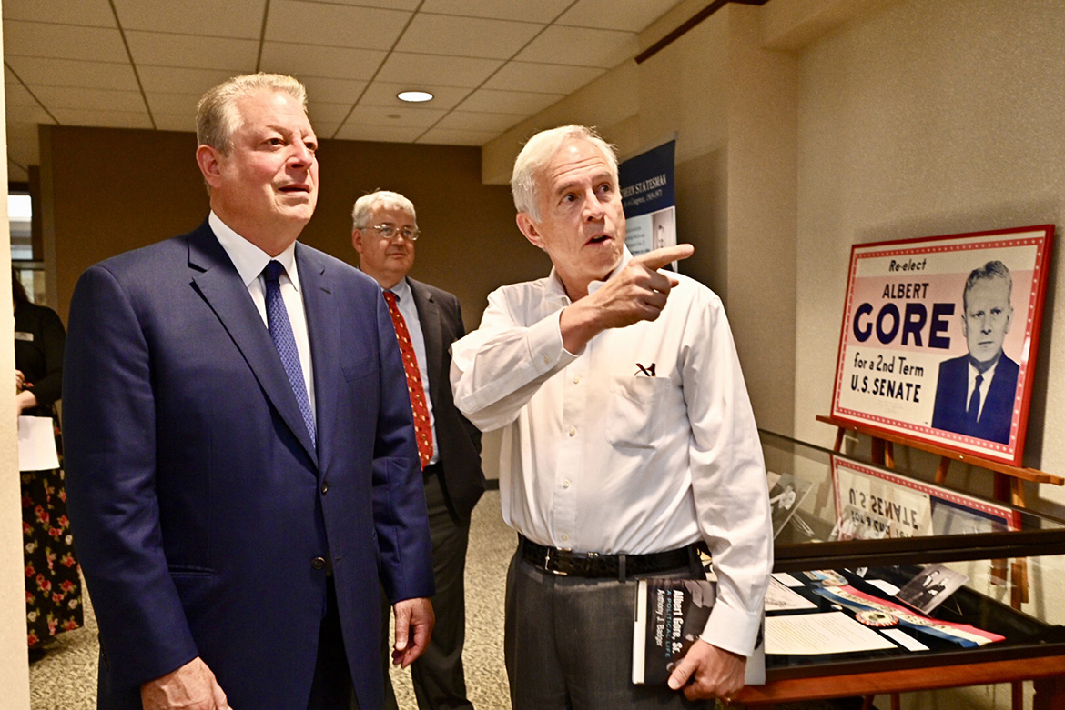 Former Vice President Al Gore, left, listens Monday, Sept. 16, as former Congressman Bart Gordon makes a point about an exhibit inside the James E. Walker Library focused on the political career of Gore’s late father, U.S. Sen. Albert Gore Sr. The younger Gore visited MTSU to participate in a public forum with author Anthony Badger about Badger’s new biography on Gore’s father. In the background is Louis Kyriakoudes, director of the Albert Gore Research Center at MTSU. (MTSU photo by J. Intintoli)