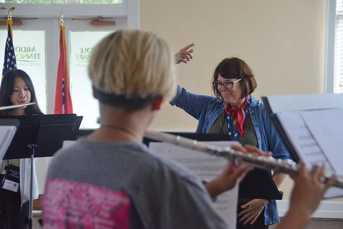 MTSU School of Music professor Deanna Little, background right, coordinates a recent rehearsal inside the Tom H. Jackson Building involving high school flute players attending the 2022 Governor’s School for the Arts. The students are preparing for the GSFTA’s grand finale June 25 to wrap up the three-week residency program. (MTSU photo by Favour Boluwade)