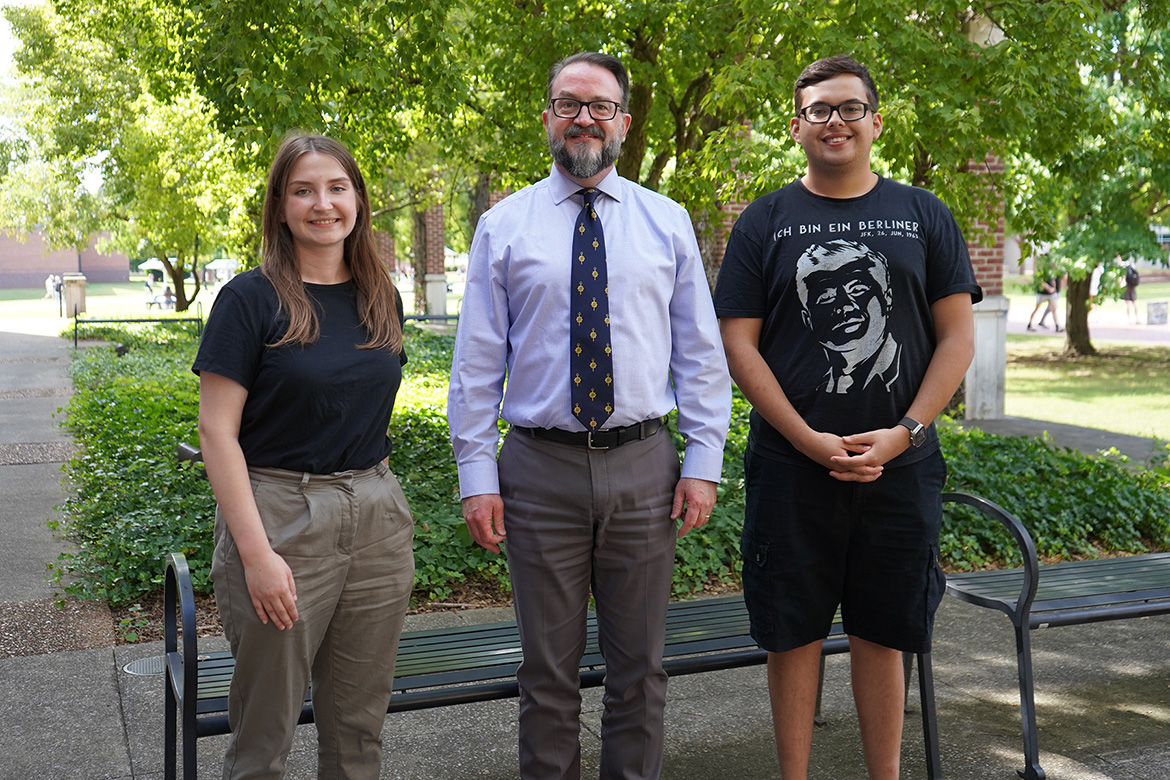 In this August 2025 photo, Middle Tennessee State University Honors students Victoria Grigsby, left, and Jorge Avila, right, stand with Philip Phillips, Honors College associate dean and president of the MTSU Chapter of Phi Kappa Phi, outside the Paul W. Martin Sr. Honors Building on campus in Murfreesboro, Tenn. Both students are recipients of the prestigious 2025 Phi Kappa Phi Pioneer Award. (MTSU photo by Robin E. Lee)