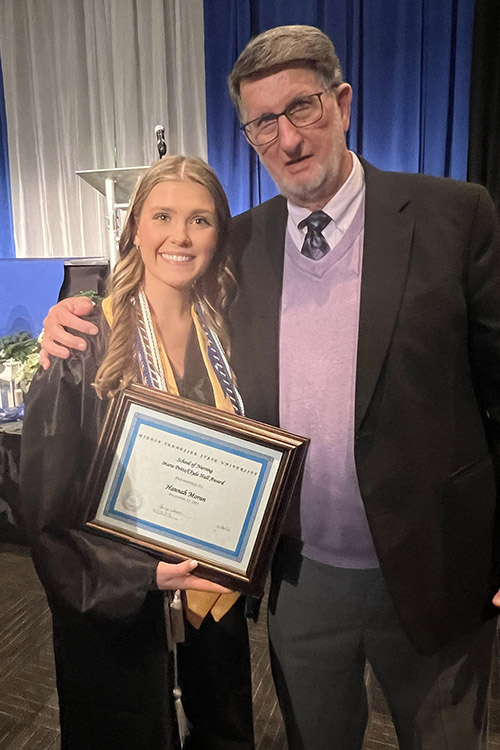 Middle Tennessee State University nursing alumnus Clyde Hall, whose endowment provides funding for the Marie Potts/Clyde Hall Personal Achievement Award scholarship for nursing students in need, stands with fall 2023 recipient Hannah Moran at the pinning ceremony for graduating School of Nursing students on Dec. 15, 2023. (Submitted photo)