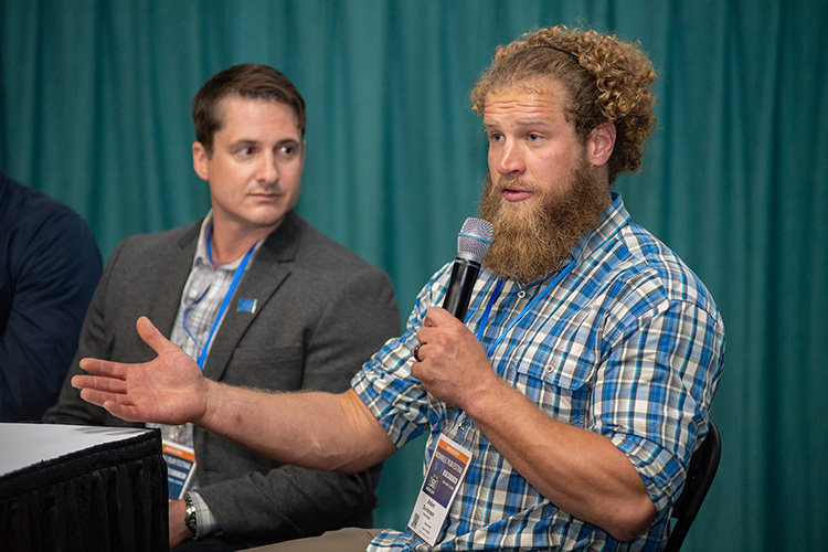 U.S. Marine veteran and Purple Heart recipient Adam Sorensen, right, answers a question as part of a panel discussion Thursday, Oct. 10, at Regal Hollywood 27 following the screening of “Homemade,” a documentary about Sorensen’s post-deployment struggles that was shown at the Nashville Film Festival. At left is Silver Star combat veteran and MTSU alumnus Jay Strobino, one of the seven panelists. (MTSU photo by James Cessna)