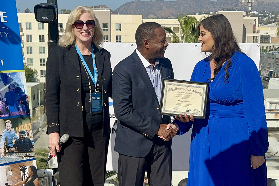 Middle Tennessee State University President Sidney A. McPhee, center, and Beverly Keel, dean of the College of Media and Entertainment, left, present Grammy-nominated singer-songwriter Jaelee Robers, right, with a framed certificate in recognition of her nomination during a special event in Los Angeles honoring MTSU alumni nominees held Saturday, Feb. 1, in advance of the 67th Grammy Awards to be held on Sunday, Feb. 2. (MTSU photo by Andrew Oppmann)