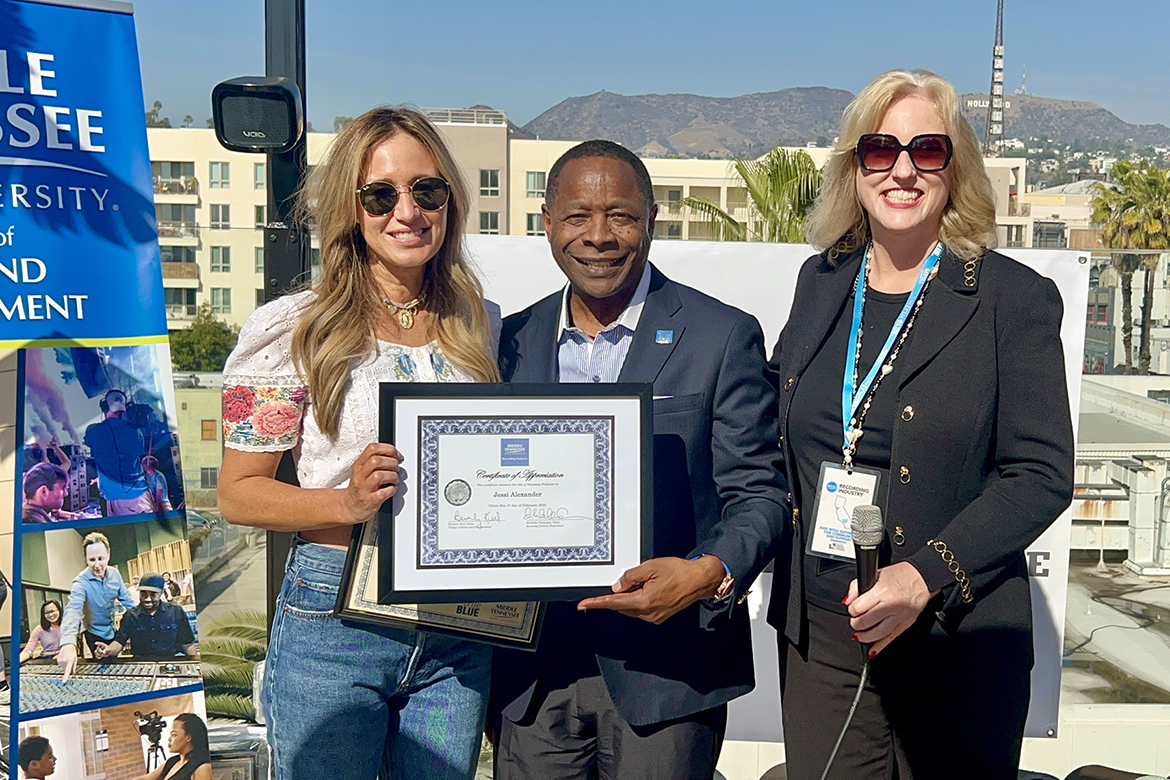 Middle Tennessee State University President Sidney A. McPhee, center, and Beverly Keel, dean of the College of Media and Entertainment, right, present Grammy-nominated singer-songwriter Jessi Alexander, left, with a framed certificate designating her an honorary professor in the Recording Industry Department during a special event in Los Angeles honoring MTSU alumni nominees Saturday, Feb. 1, in advance of the 67th Grammy Awards to be held on Sunday, Feb. 2. (MTSU photo by Andrew Oppmann)