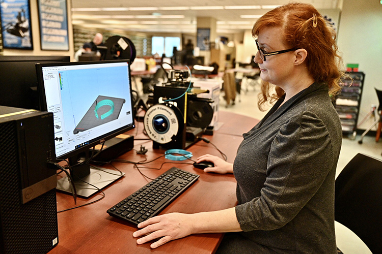 MTSU’s Valerie Hackworth, assistant manager of library technology in the James E. Walker Library Makerspace, makes face shield headbands that will be shipped to the Tennessee Emergency Management Agency for distribution to health care workers treating coronavirus patients across the state. (MTSU photo by J. Intintoli)